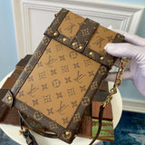 Louis Vuitton VERTICAL TRUNK POCHETTE